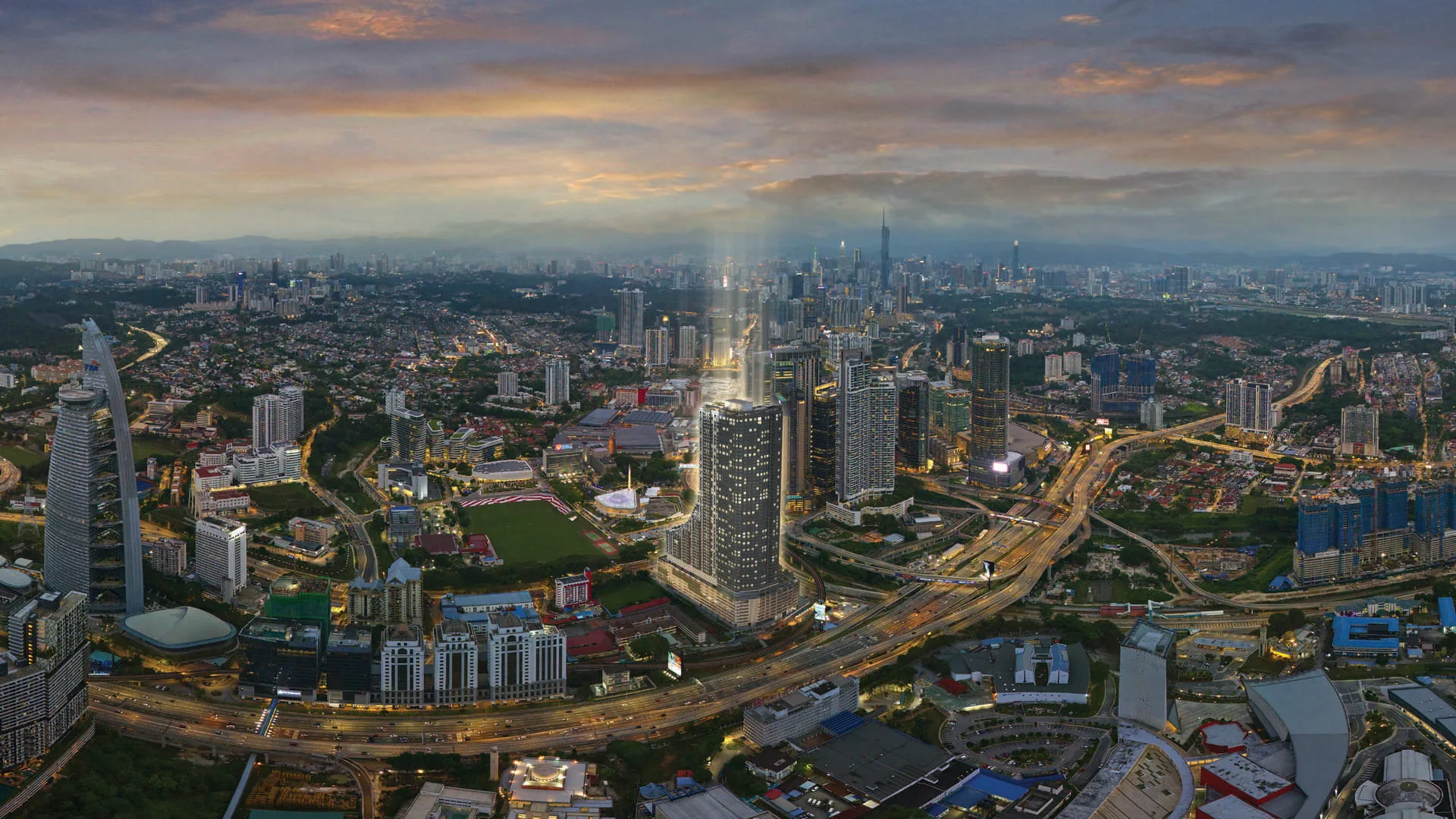 Khaya Residences tower rising above the Kuala Lumpur skyline near Bangsar at dusk